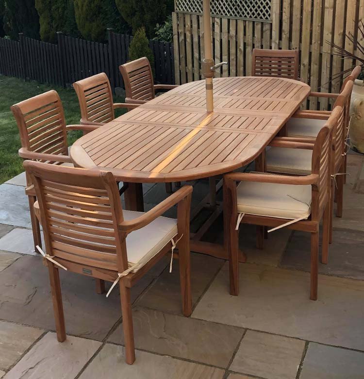 Teak garden dining set is amazing value - double extending table 1.8m to 2.4m, 8 x teak stacking chairs, free 3m parasol and cushions
